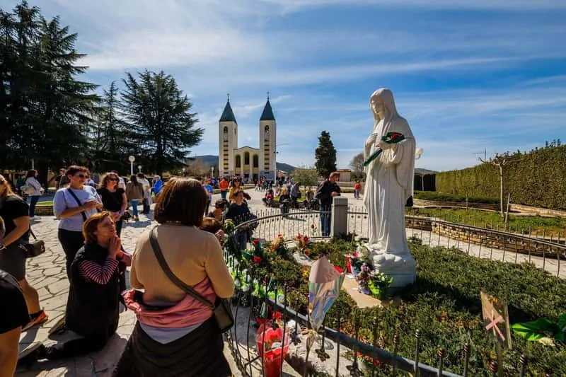 Small group of pilgrims visiting the shrine of Medjugorje on a guided tour from Dubrovnik
