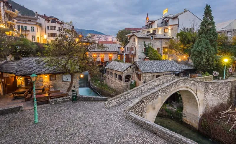 Old Bridge of Mostar reflected in the Neretva River on a Medjugorje tour from Split